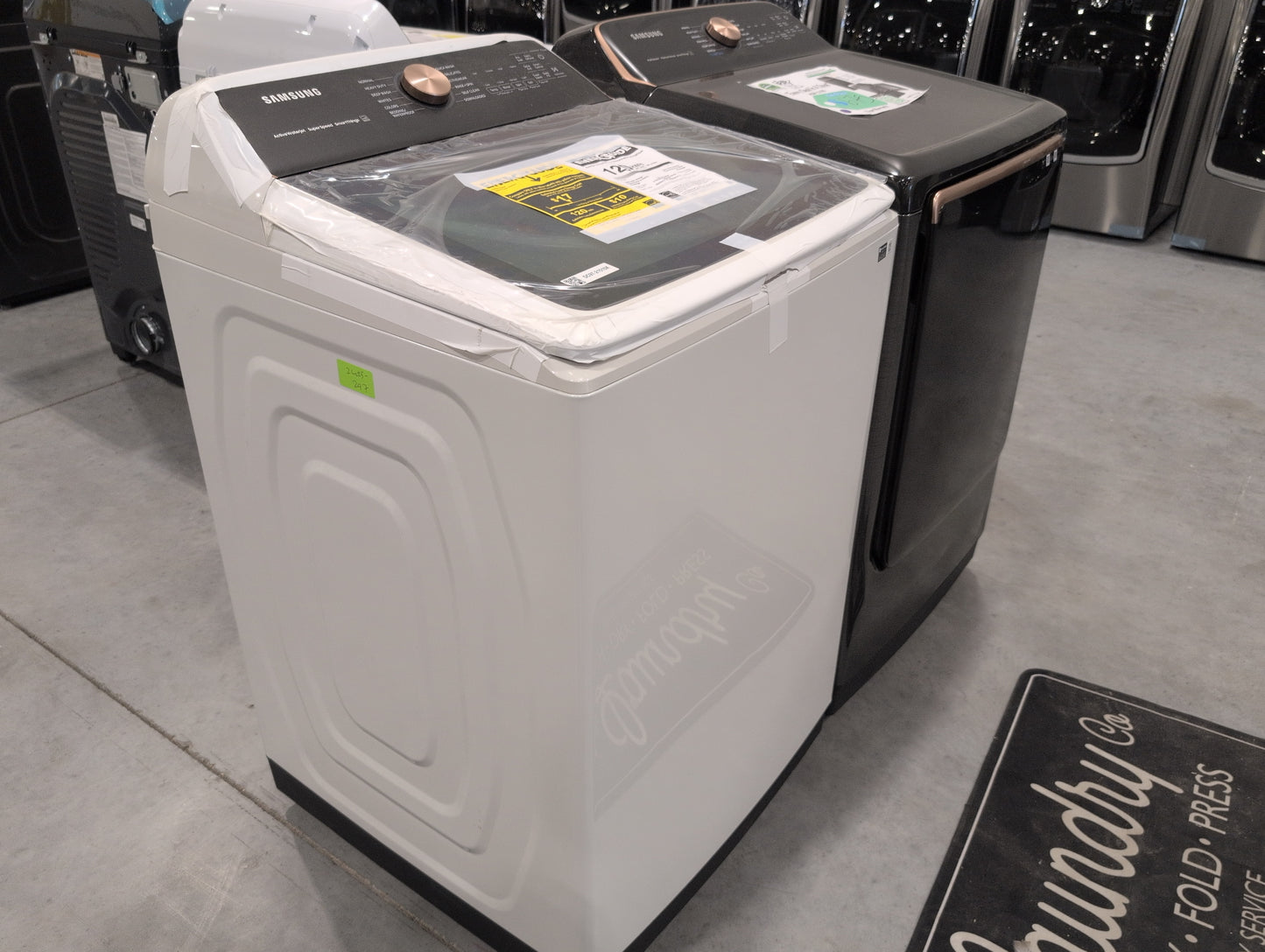 SAMSUNG WA55A7300AE 5.5 cu. ft. Extra-Large Capacity Smart Top Load Washer with Auto Dispense System in Ivory & SAMSUNG DVE55A7700V/A3 7.4 cu. ft. Smart Electric Dryer with Steam Sanitize+ in Brushed Black
