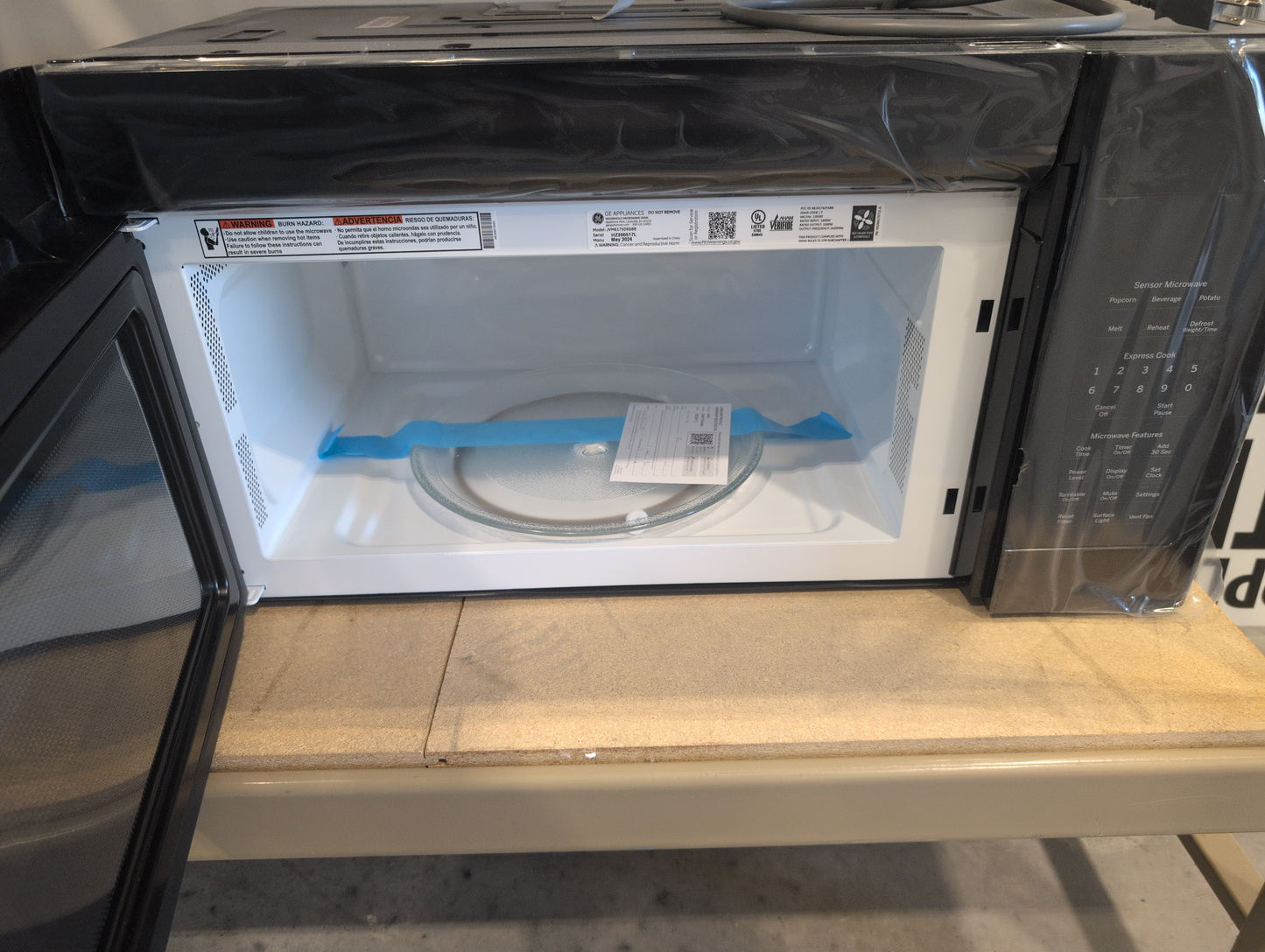 GE JVM6175DKBB 1.7 cu. ft. Over-the-Range Microwave with 1,000 Watts, 300 CFM Ventilation, 10 Power Levels, Sensor Cooking, Melt Feature, Add 30 Seconds Button, Weight and Time Defrost, Clock and Timer and Charcoal Filter: Black